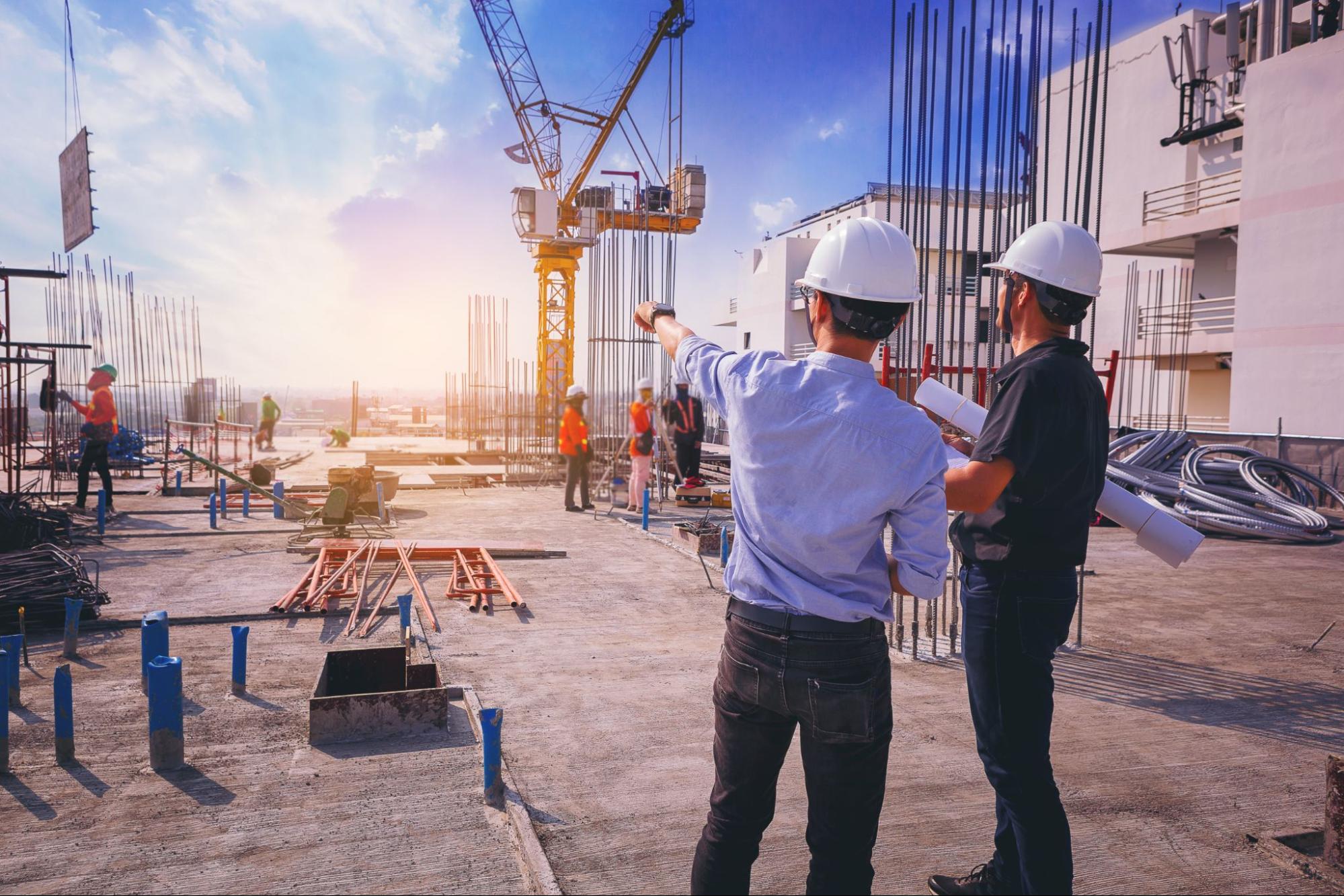 Construction professionals reviewing building works on site